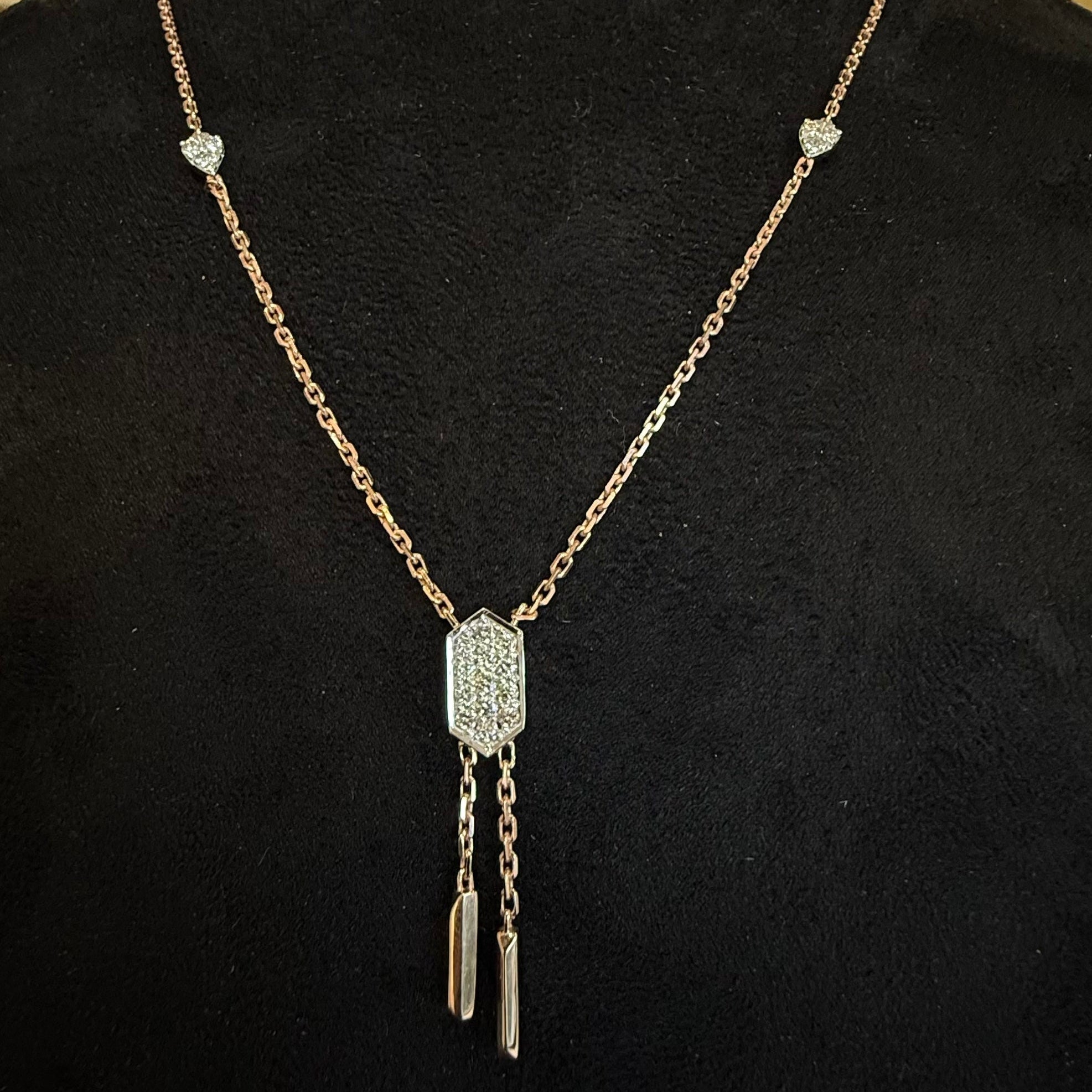Diamond necklace with a decorative pendant on a black background
