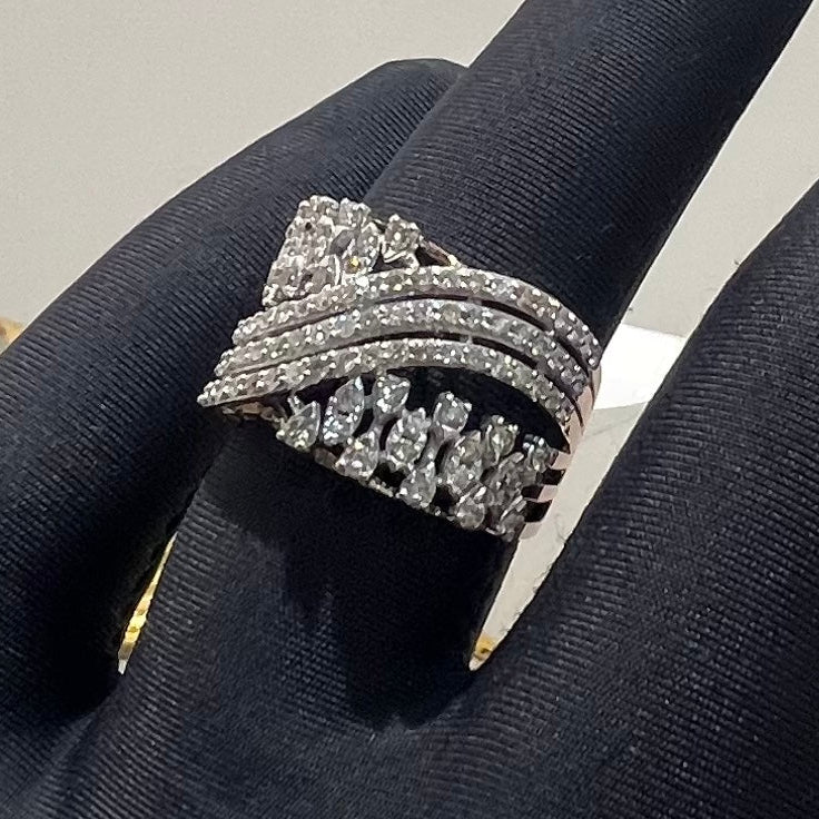 Gold ring with diamond accents on a black glove