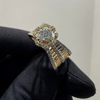 Gold ring with a diamonds on a black glove