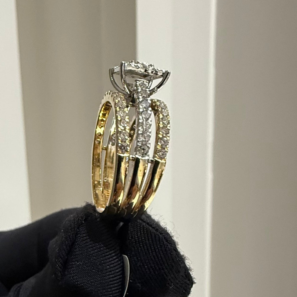 Diamond ring held by a gloved hand against a neutral background