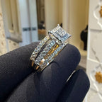 Diamond ring on a dark surface with a blurred indoor background