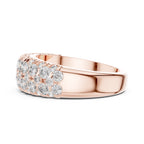Rose gold ring with diamond accents on a white background