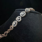 Diamond bracelet on a black velvet stand with a dark background