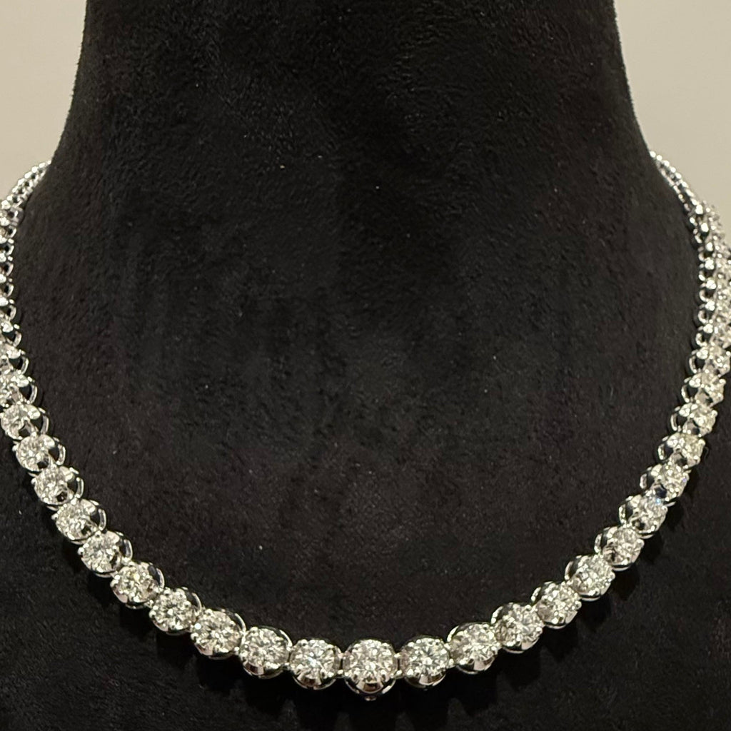 White gold diamond tennis necklace on a black mannequin bust