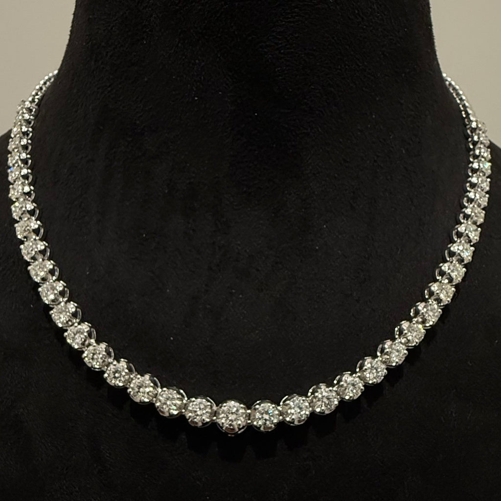 White gold and diamond tennis necklace on a black mannequin