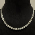 White gold and diamond tennis necklace on a black mannequin