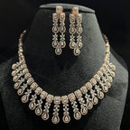 Diamond necklace and earrings set on a black mannequin bust