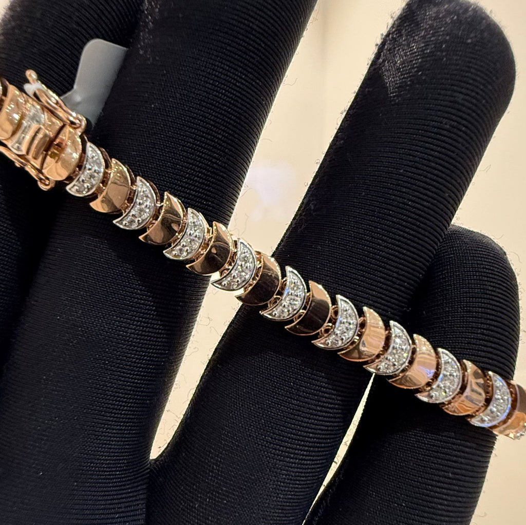 Gold bracelet with diamonds on a black stand